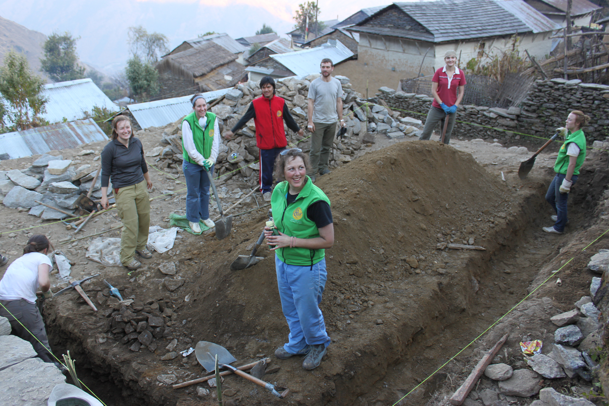 Volunteers about to being work for the day, digging and building foundations of kindergarden project
